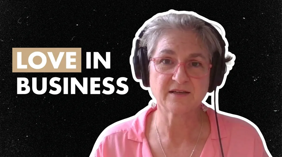 Image of Cordes talking with headphones and the text "Love in Business"