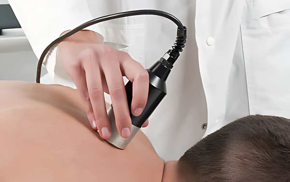 a man getting his leg examined by a doctor
