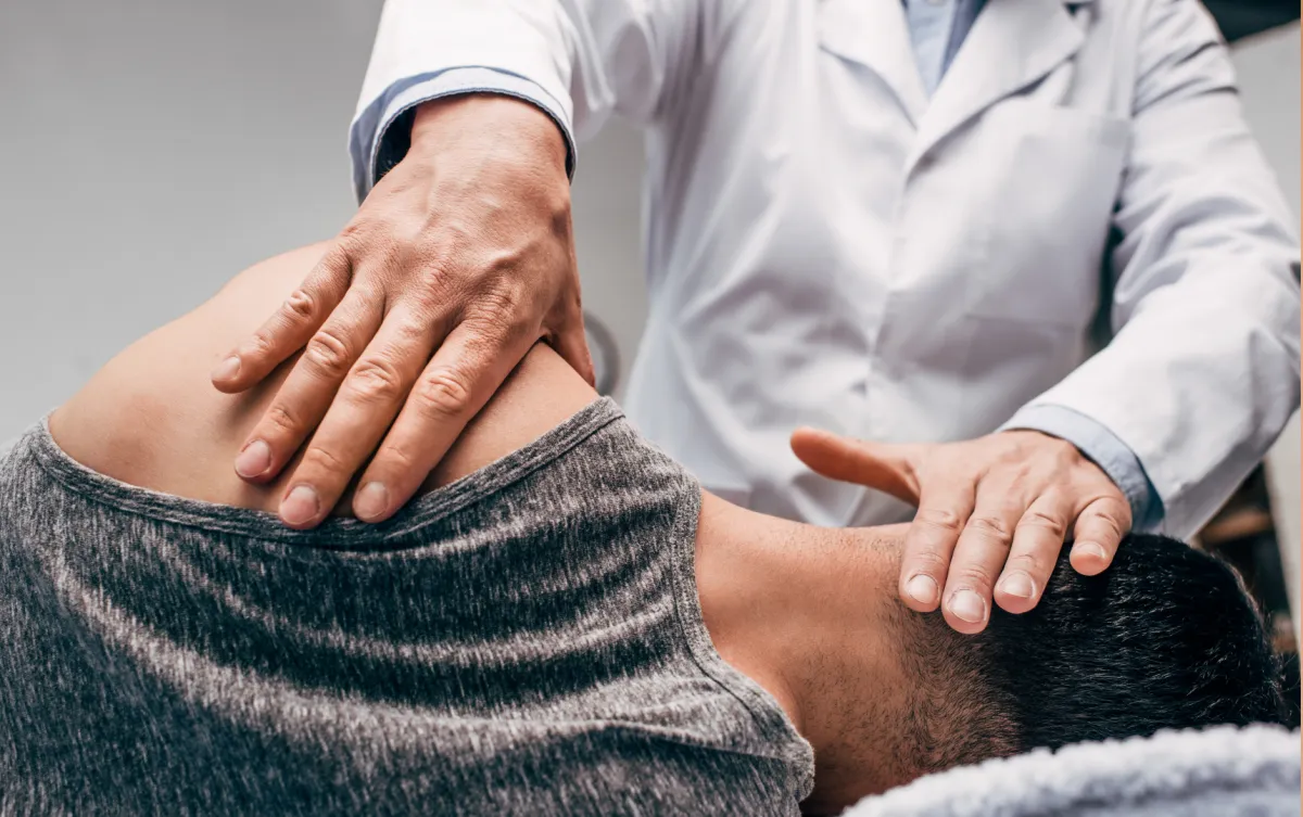 a man getting his leg examined by a doctor