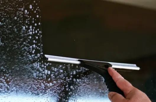 Modern house with a paved driveway and garage.
