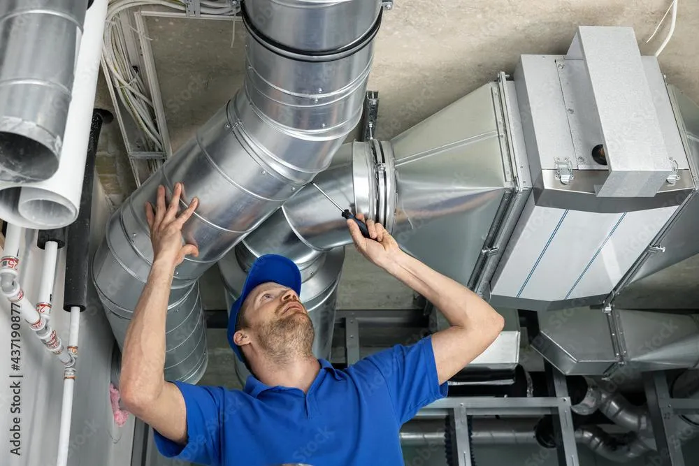 man working on ductwork