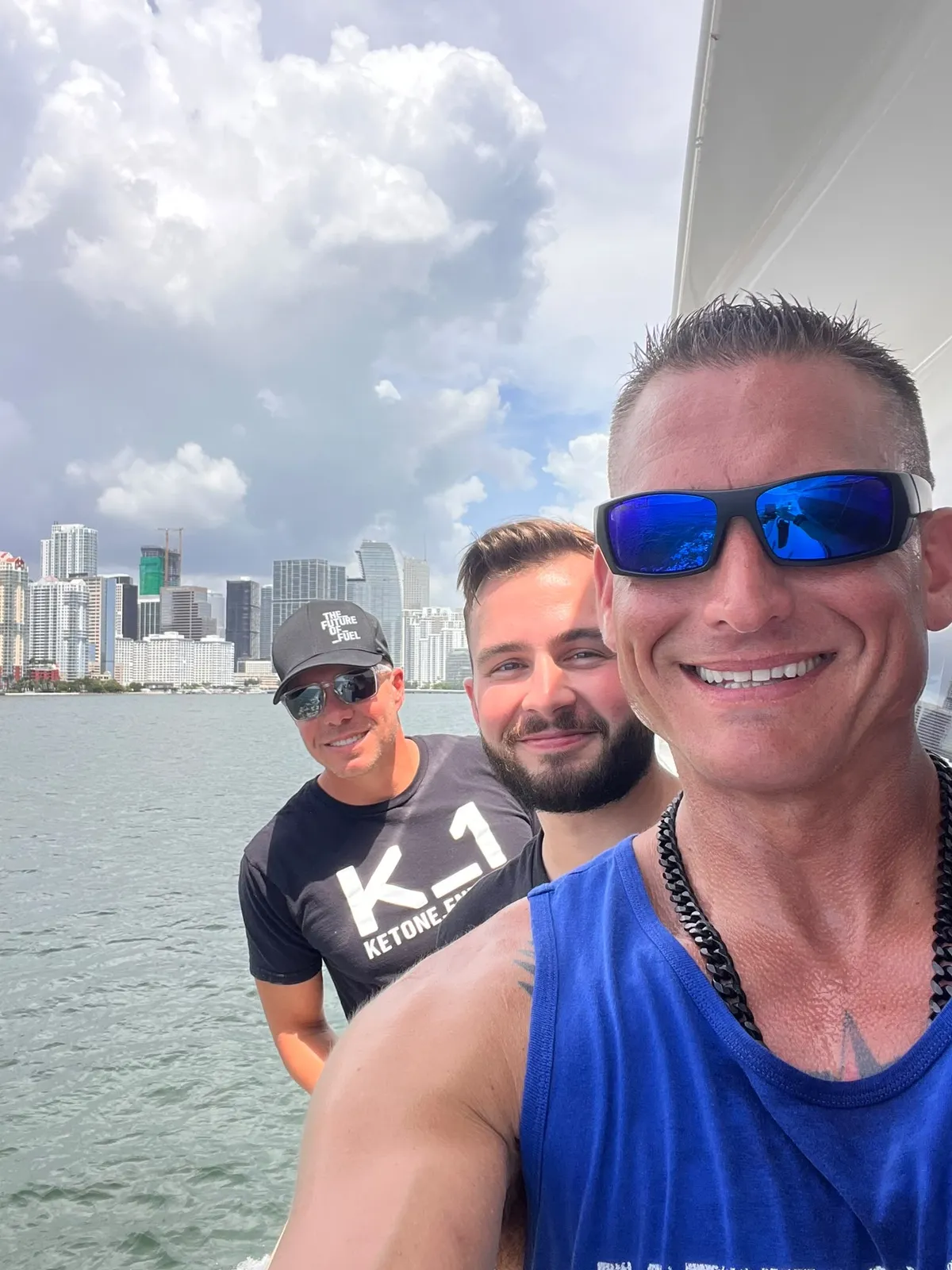 Three Momentum Pro team members together on the water