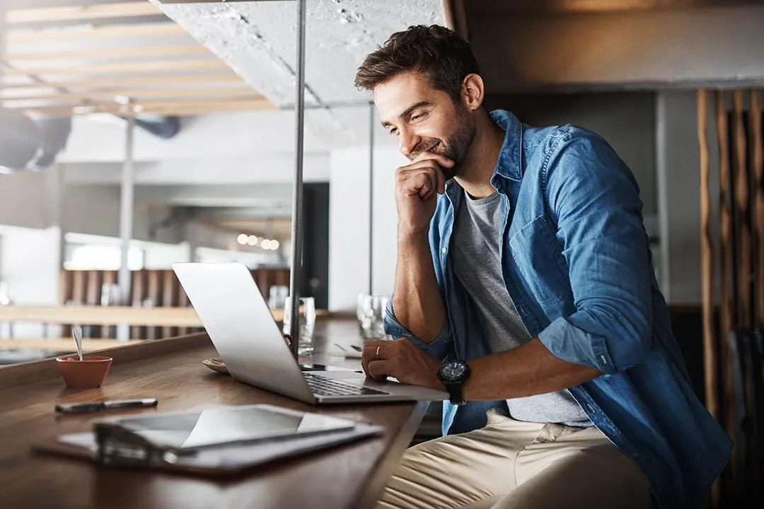 Person Checking Loan Options on Laptop