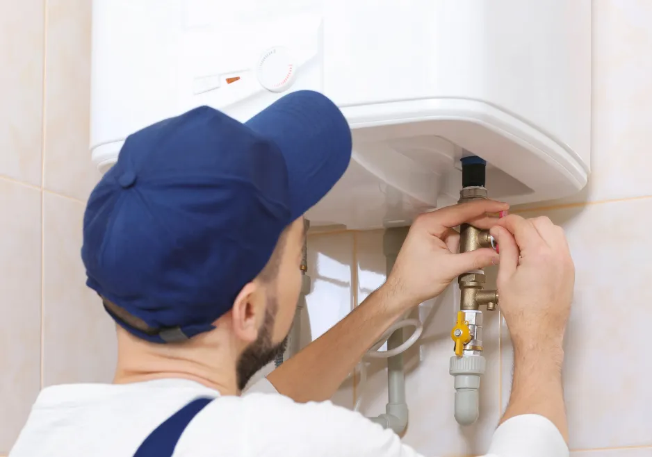 Bravo Plumbing technician servicing a water heater in Highlands Ranch Colorado