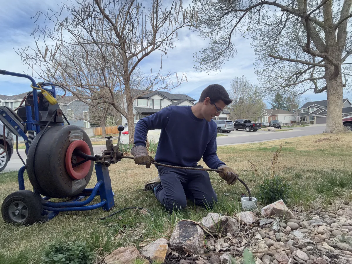 Bravo Plumbing technician inspecting a drainage line in Highlands Ranch Colorado
