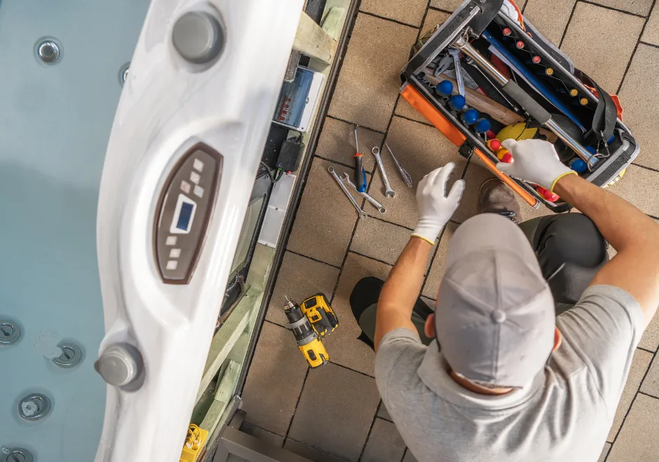 Plumber inspecting the connections on a specialized plumbing system