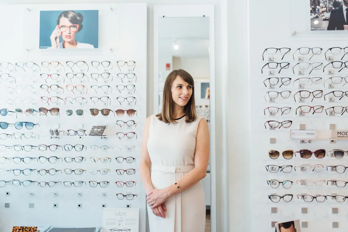 Smiling patient with eye doctor at Pine Vision Care clinic in Philadelphia.