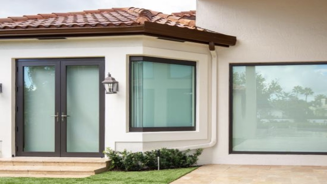 Impact-rated windows designed to withstand windborne debris during severe storms