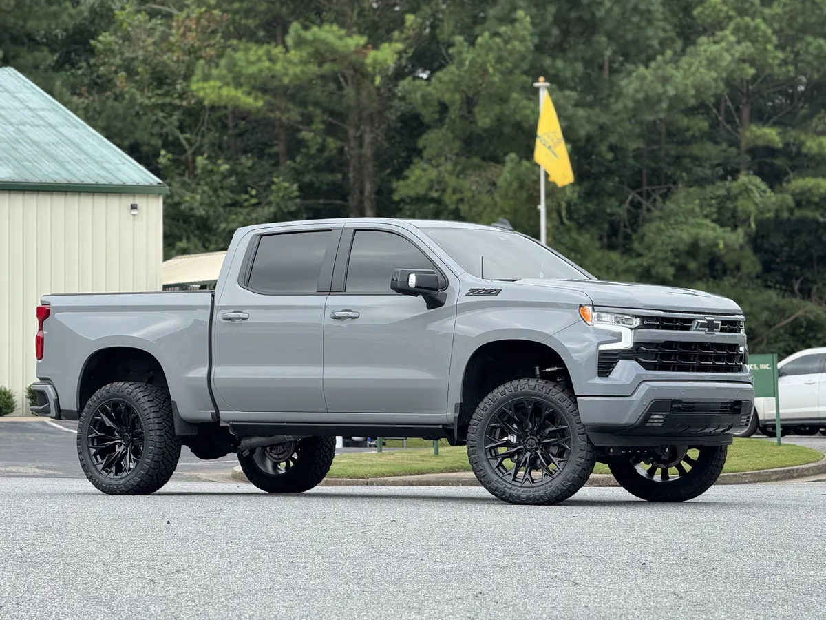 Hardline Customs blue lifted Jeep with custom wheels and tires