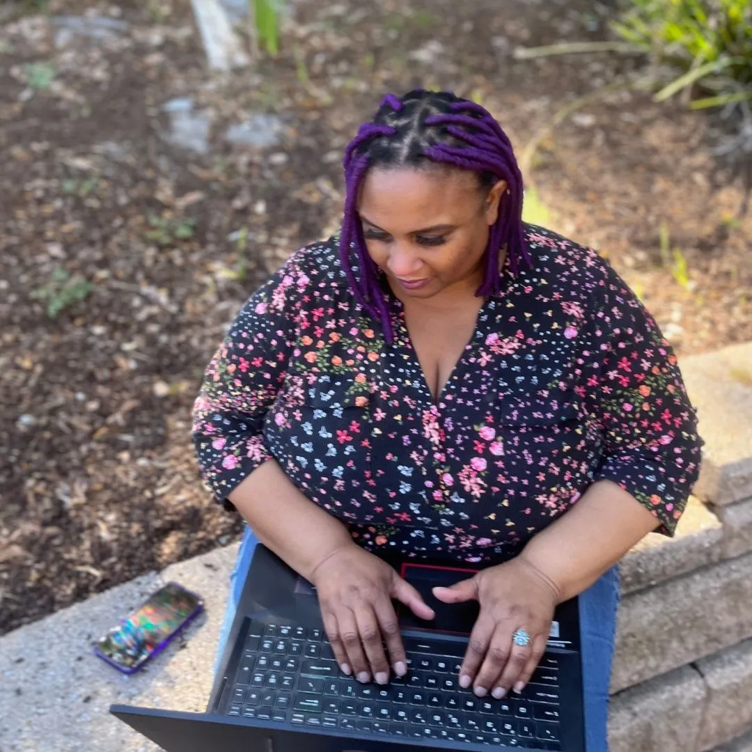 Africa Archield doing a one-on-one onboarding all outdoors