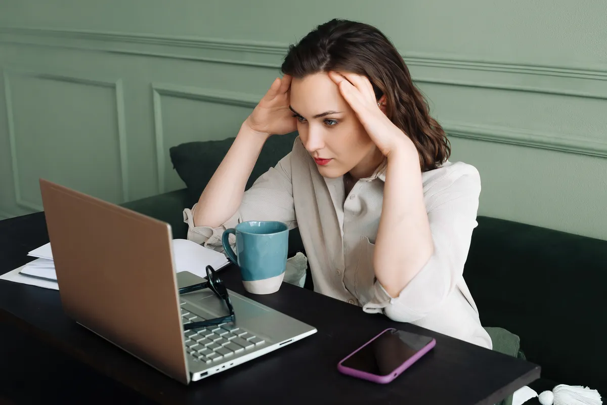 stressed woman duct taping online systems together