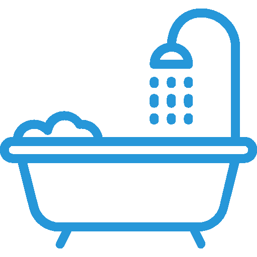 Bathtub with showerhead, symbolizing plumbing services for water filtration and softening systems.