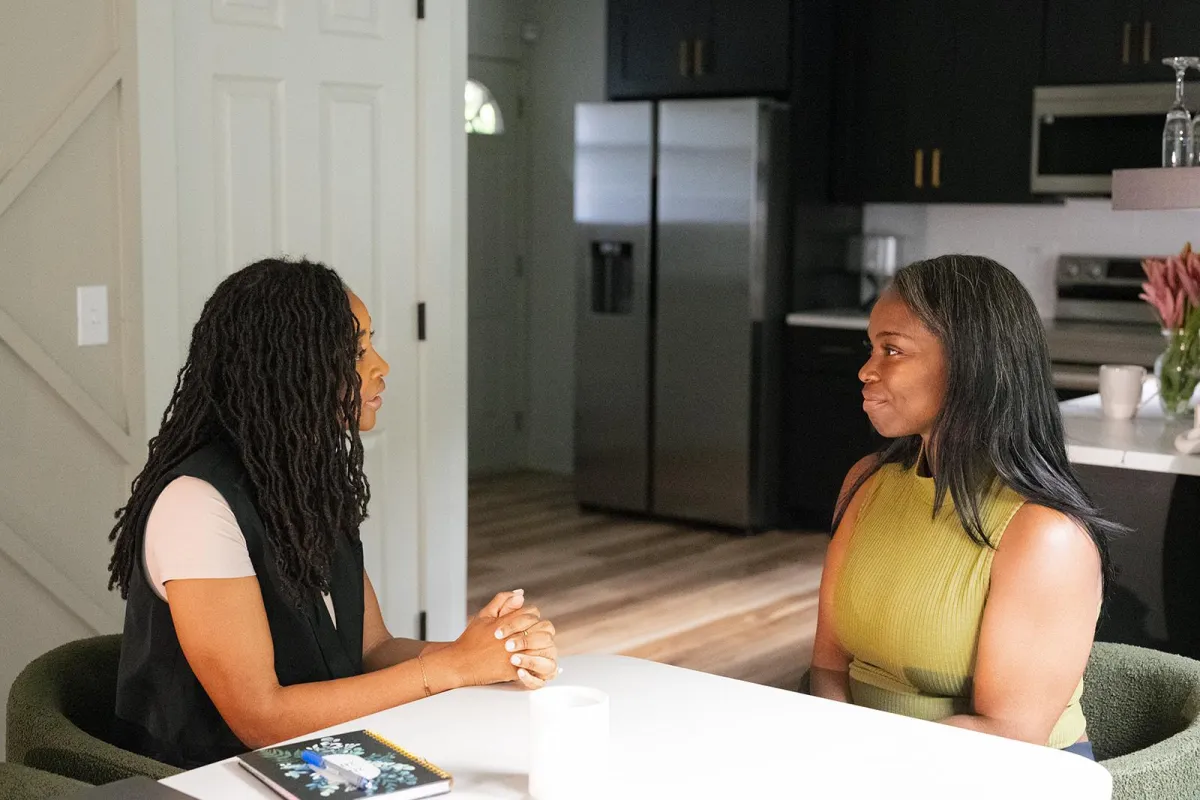 Woman offering emotional and spiritual support to a friend