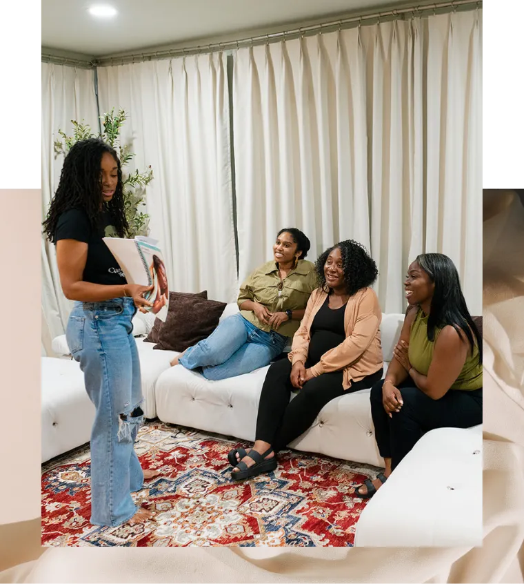 Woman leading a small group of women sharing birth preparation resources