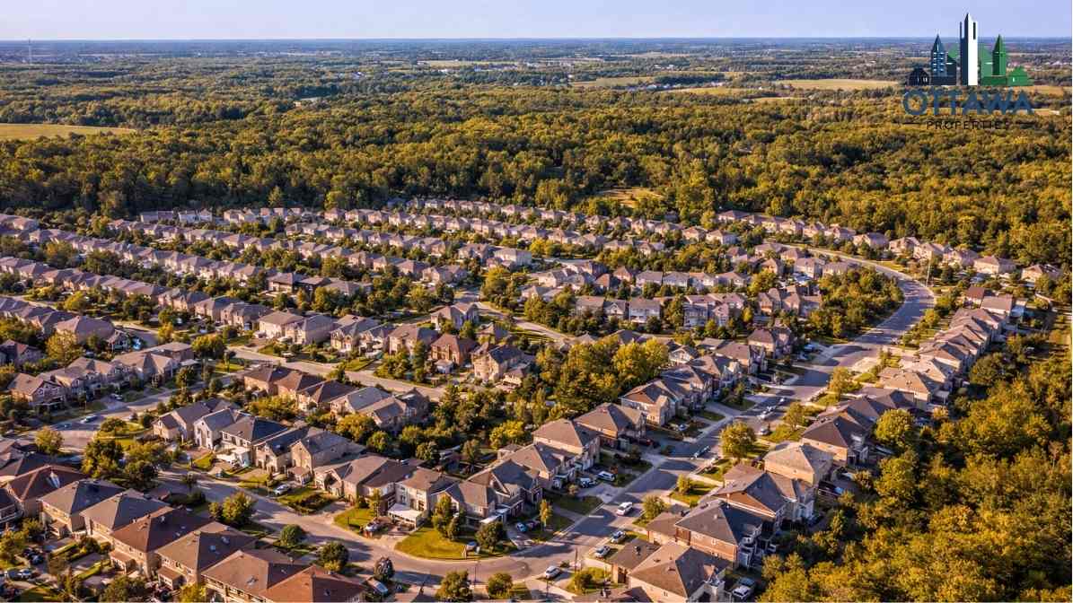 Aerial view of a suburban neighborhood in Ottawa featuring rows of houses surrounded by greenery, emphasizing family-friendly living and community appeal.