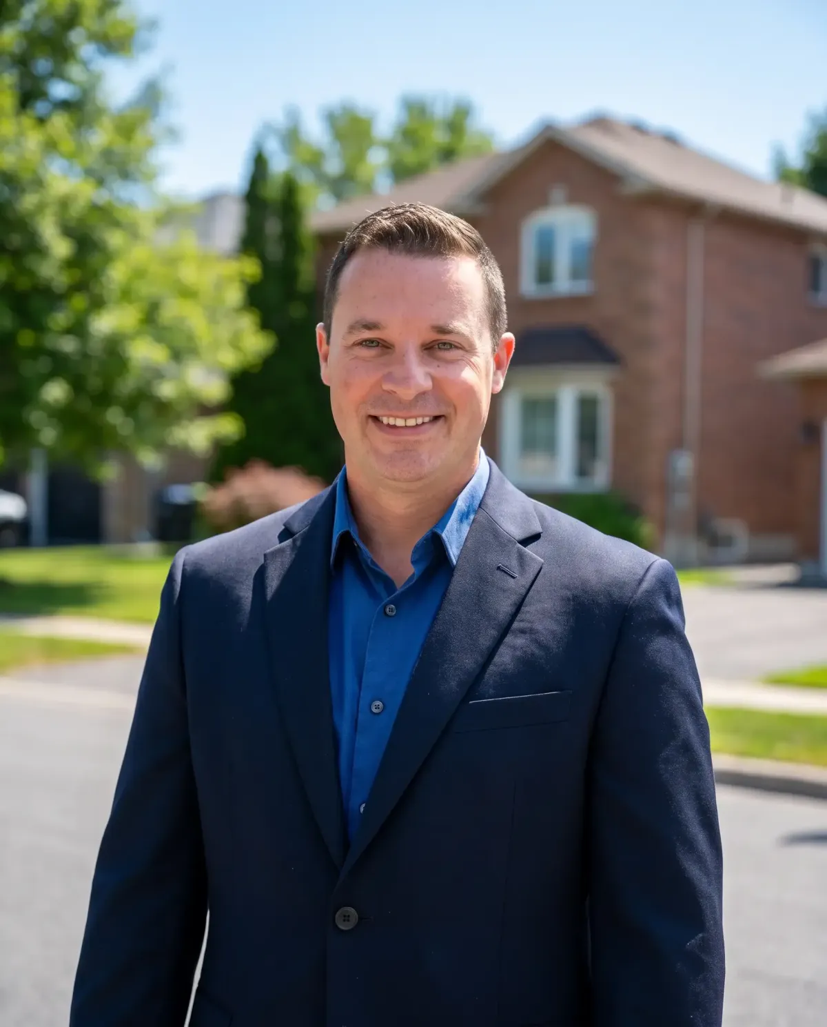 Derek Walker, Ottawa Properties real estate broker, on a bright tree-lined Ottawa street