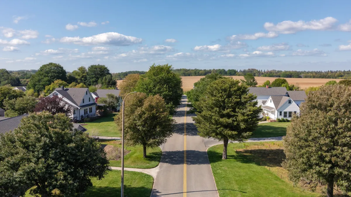  Quiet semi-rural village road with homes and farmland on the eastern edge of Ottawa near Cumberland and Navan