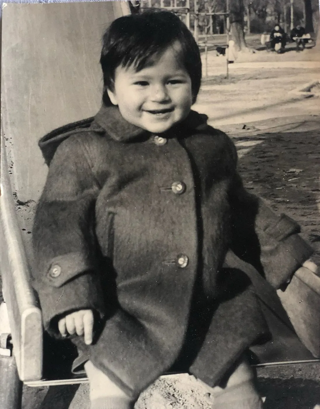 Matteo as a small child in a winter coat, an old black and white photo