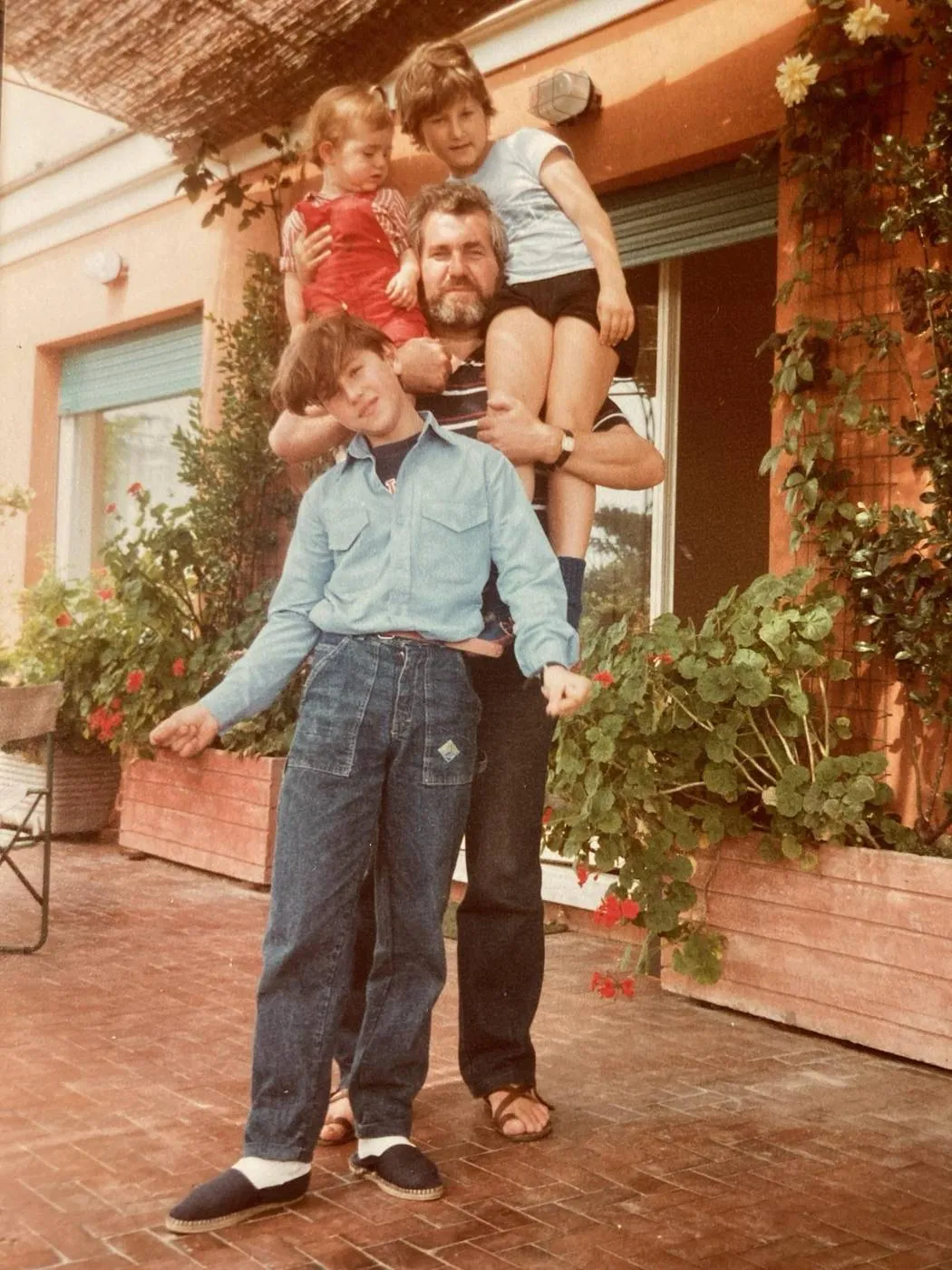 Matteo's father with his three children, an old family photo
