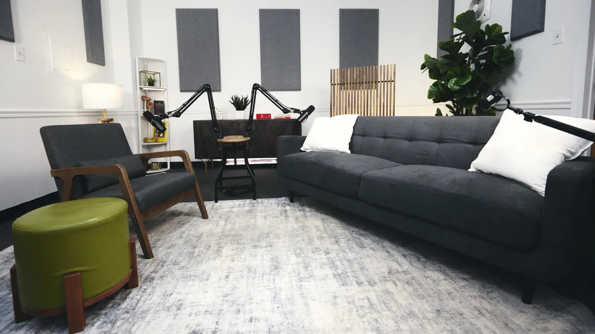 a microphone on a stand in front of a red background