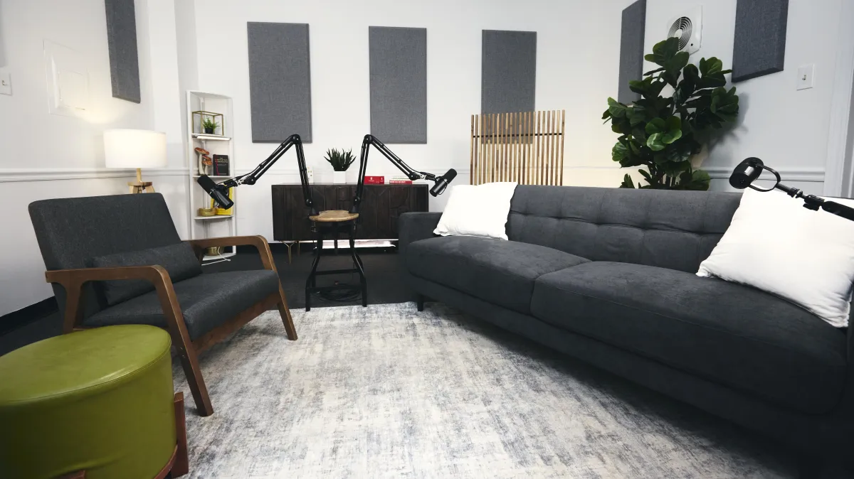 a microphone on a stand in front of a red background