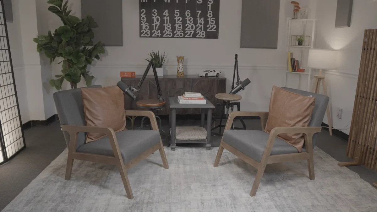 three person standing near wall inside building