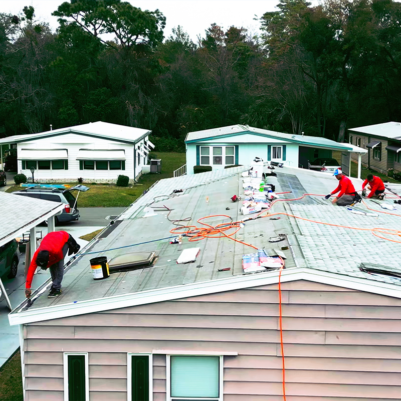 Bonita Springs Mobile Home Roofing sealing seams and edges on a mobile home roofing project for a homeowner.