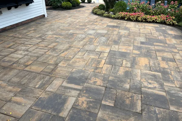 Wet spot on concrete driveway after rain