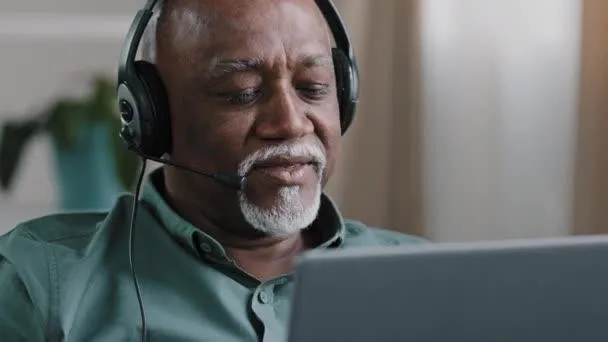 man listening to piano lessons