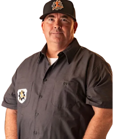 Coach Raul working 1-on-1 with athlete in batting cage