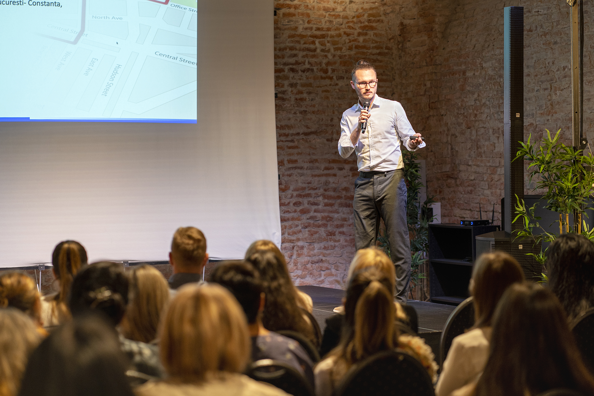 Woman wearing glasses smiling in an office setting