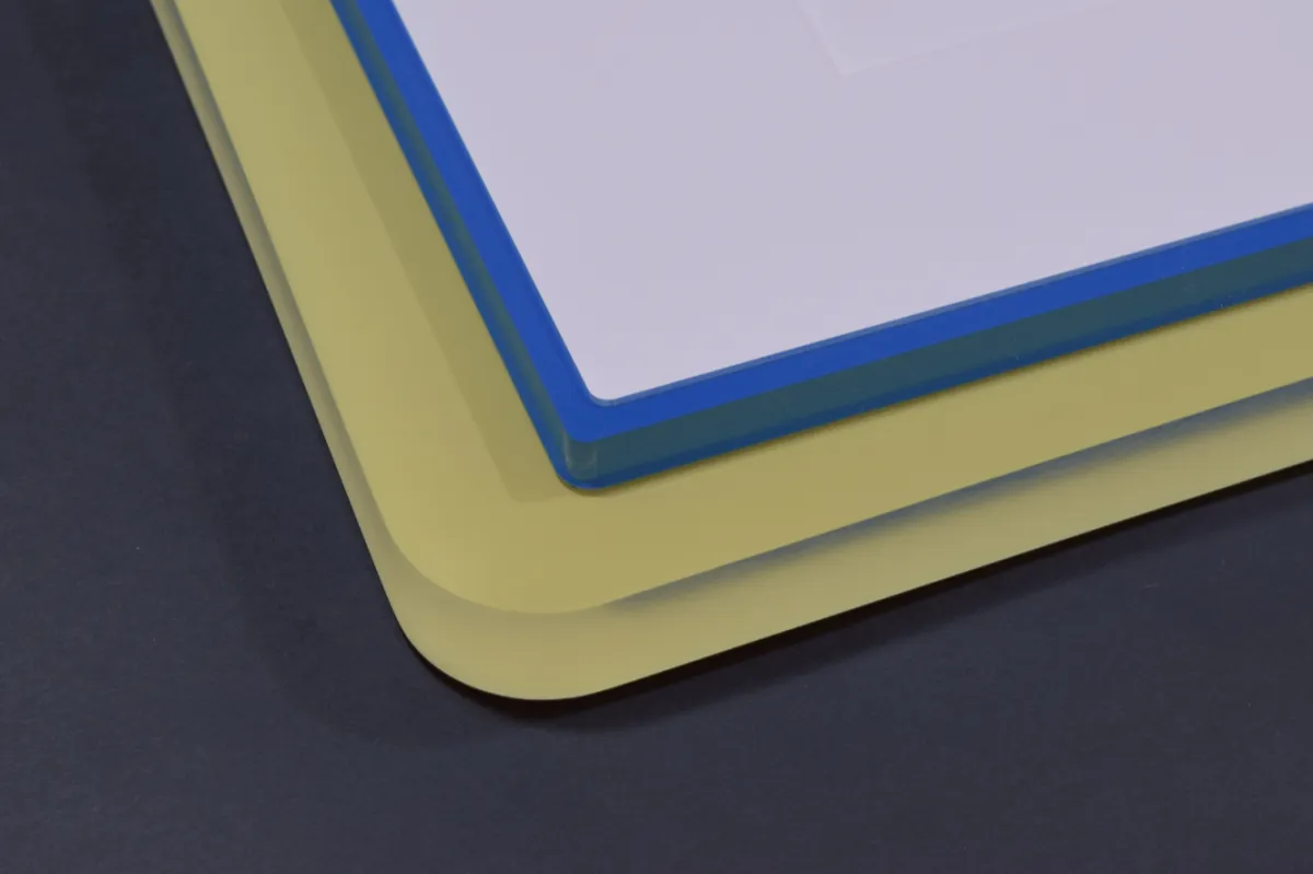 Stacked sheets of colored acrylic used for custom acrylic picture framing
