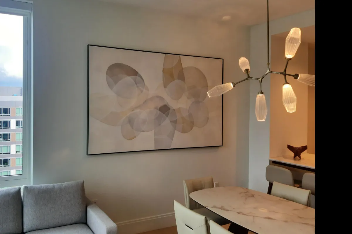 Large framed abstract artwork professionally displayed on an interior wall