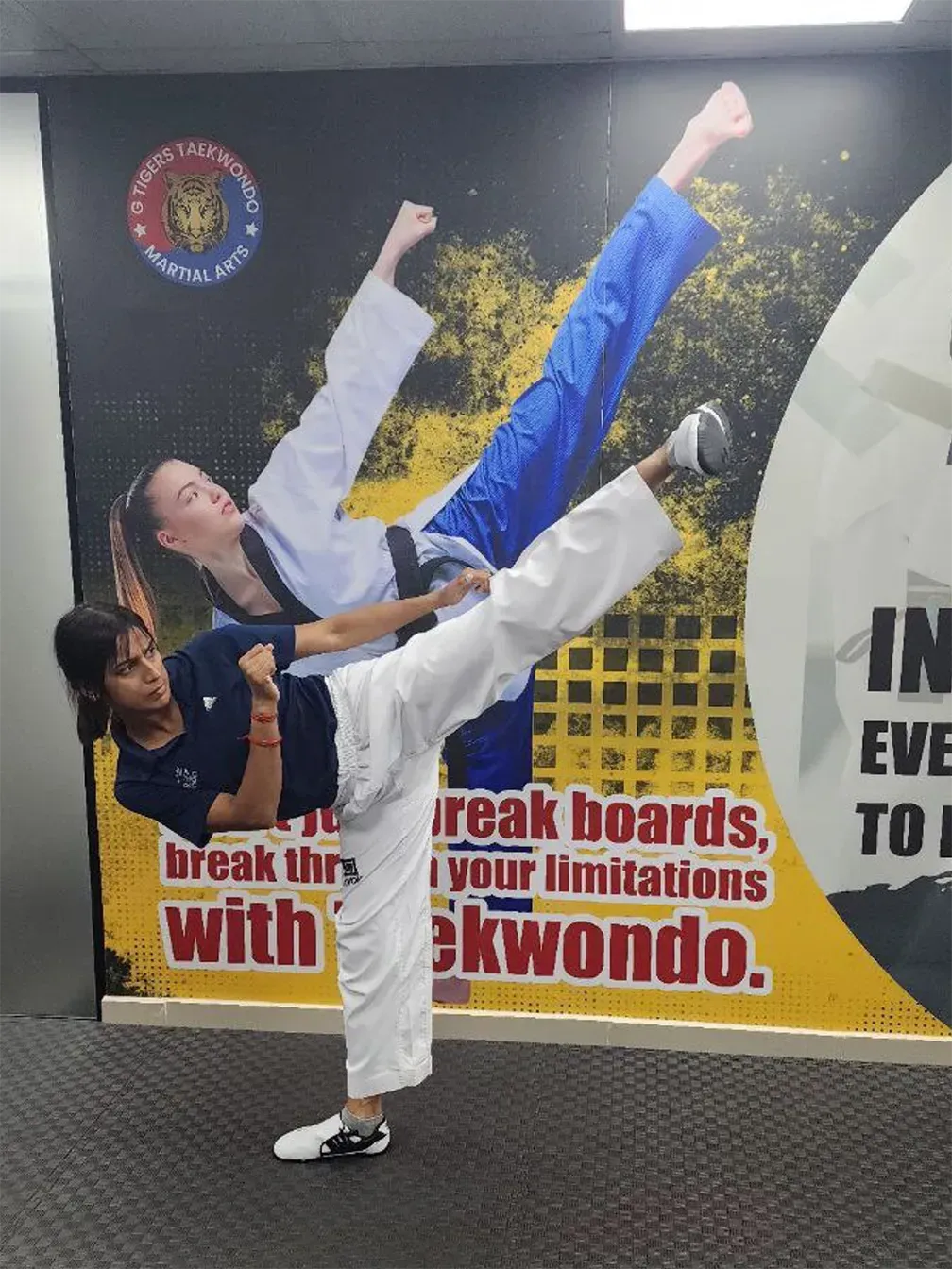 image - girl doing a taekwondo kick