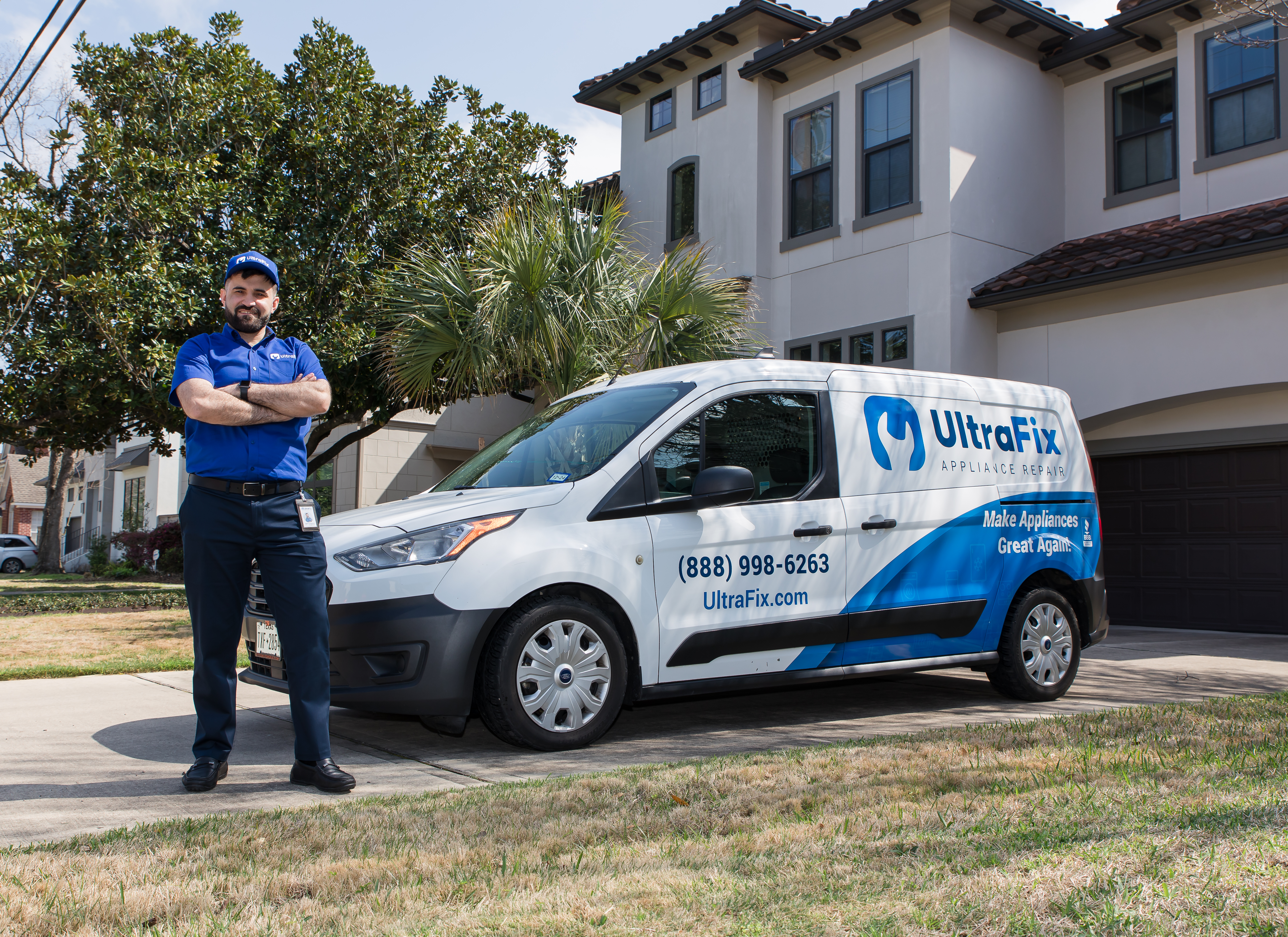 Mechanic using screwdriver on car engine