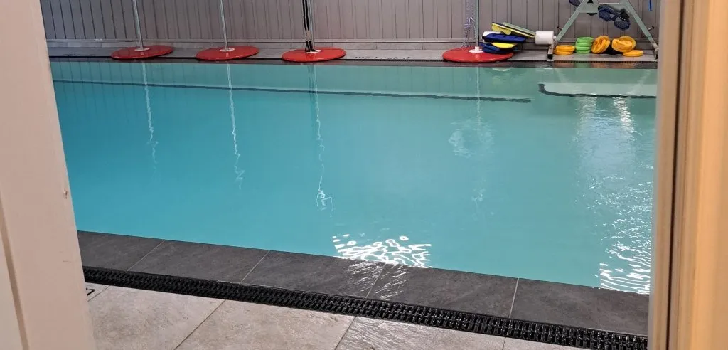 Dedicated private coaching lane in clear heated pool with instructional equipment