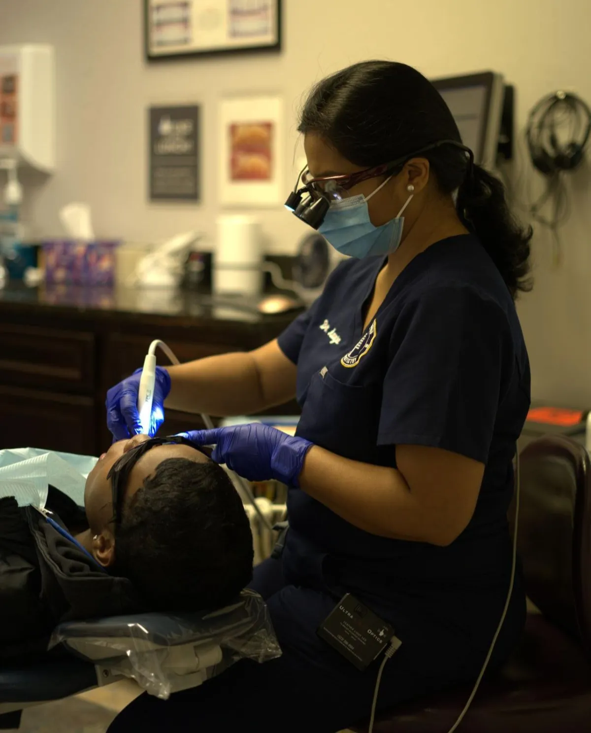 Dentist performing LANAP procedure