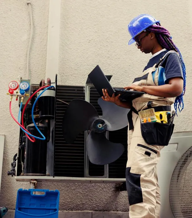 Certified HVAC technician repairing an air conditioning unit in Olney, MD, providing expert HVAC services for homes and businesses