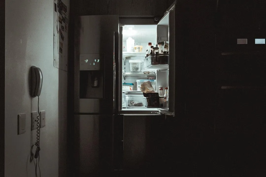 Modern residential refrigerator being serviced by experts in Olney MD, ensuring reliable and efficient refrigeration solutions.