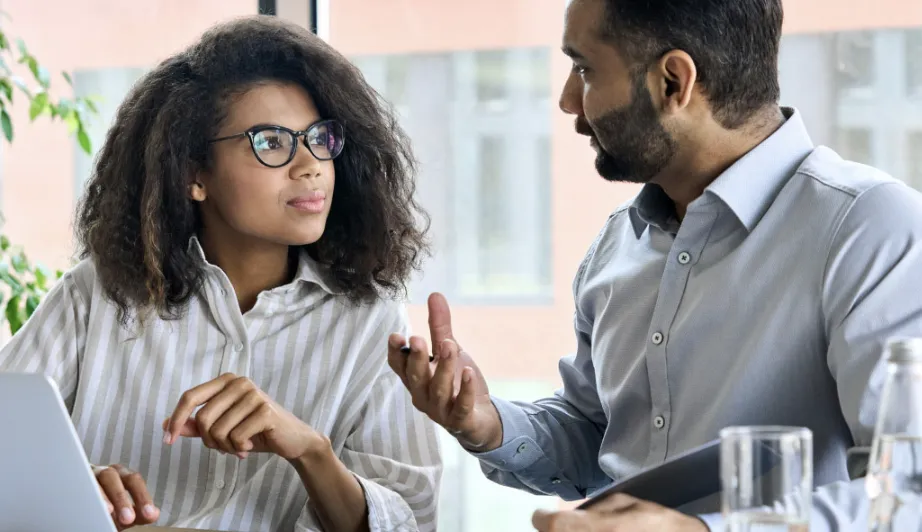 Two doctors looking at a medical scan on tablet