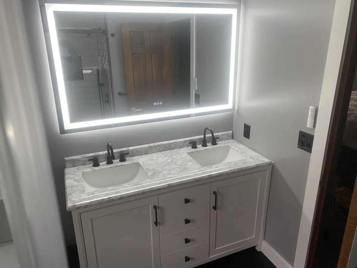 a modern kitchen with a marble counter top