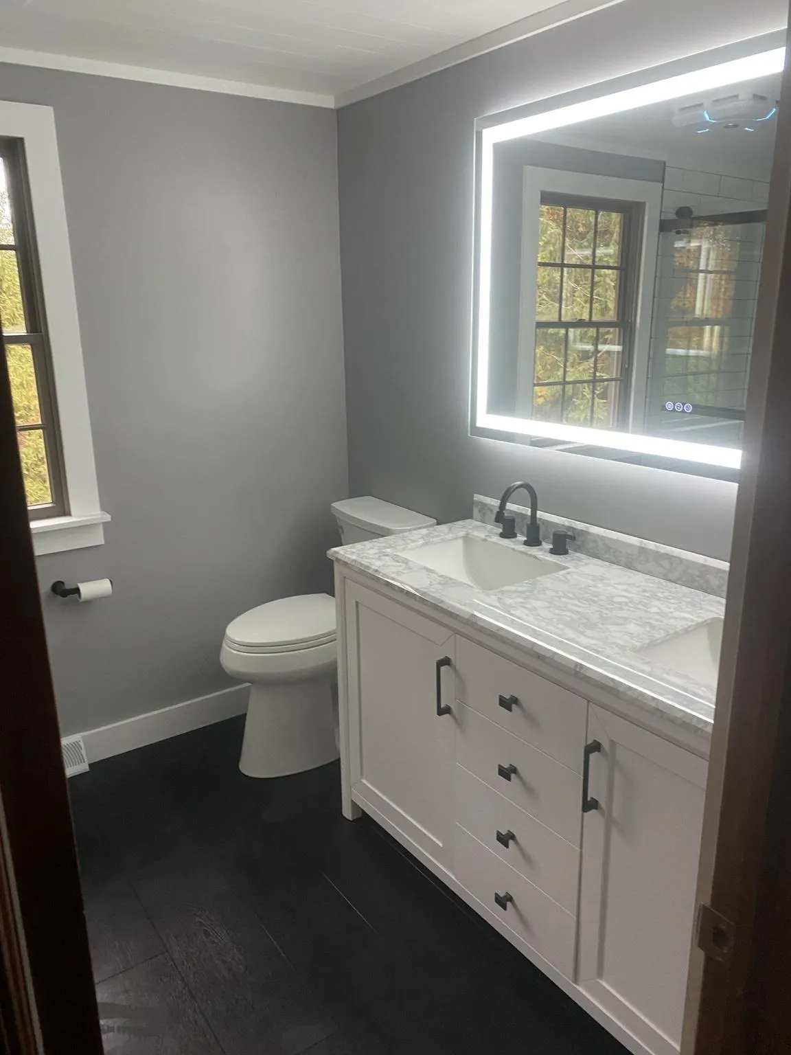 a modern kitchen with a marble counter top