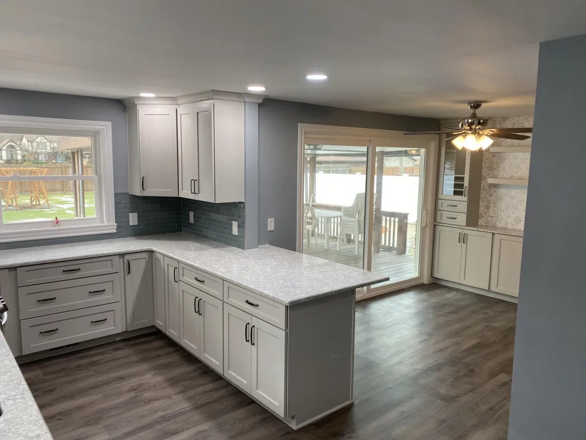 a kitchen with white cabinets