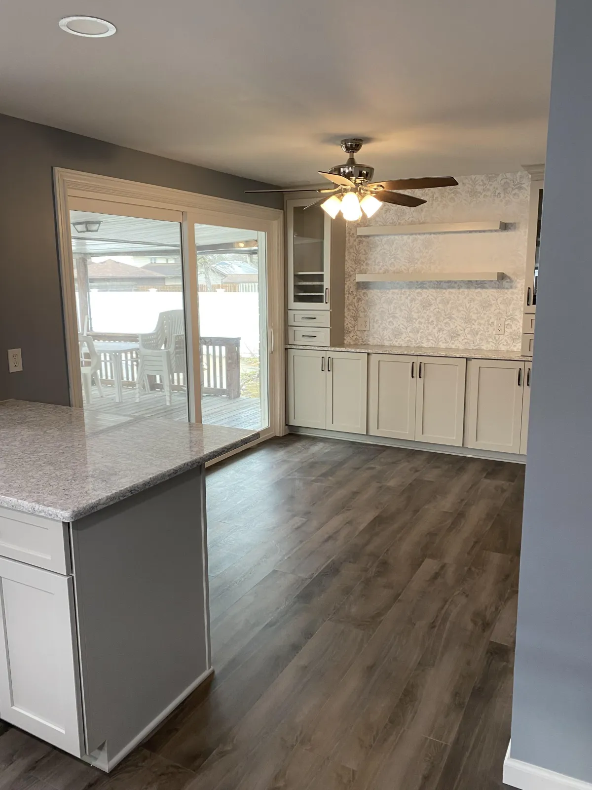 a kitchen with white cabinets