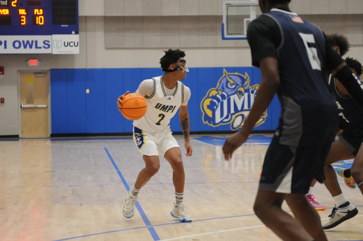 2 person wearing backpacks and backpacks standing on green grass field during daytime