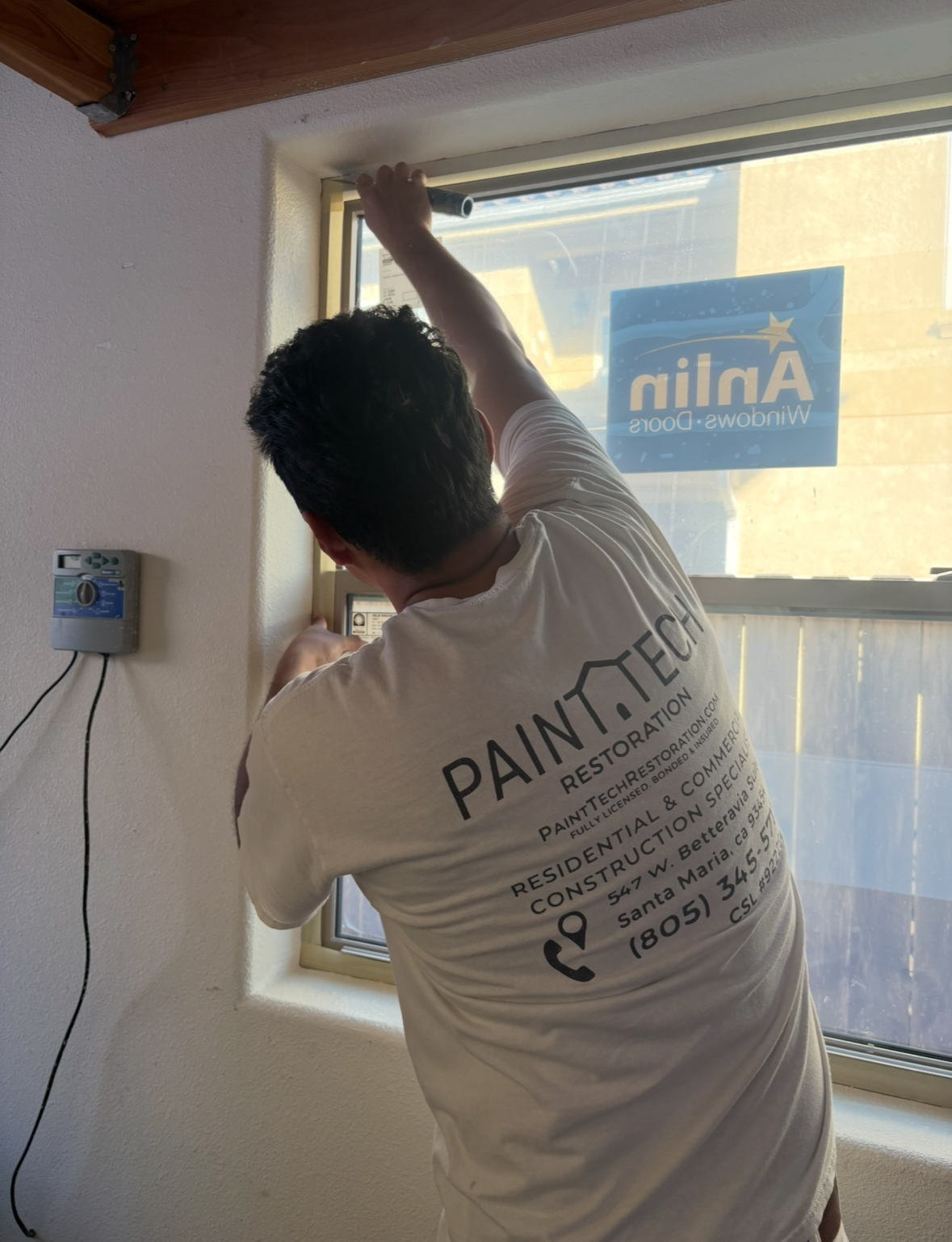 a woman wearing a hard hat holding a piece of paper