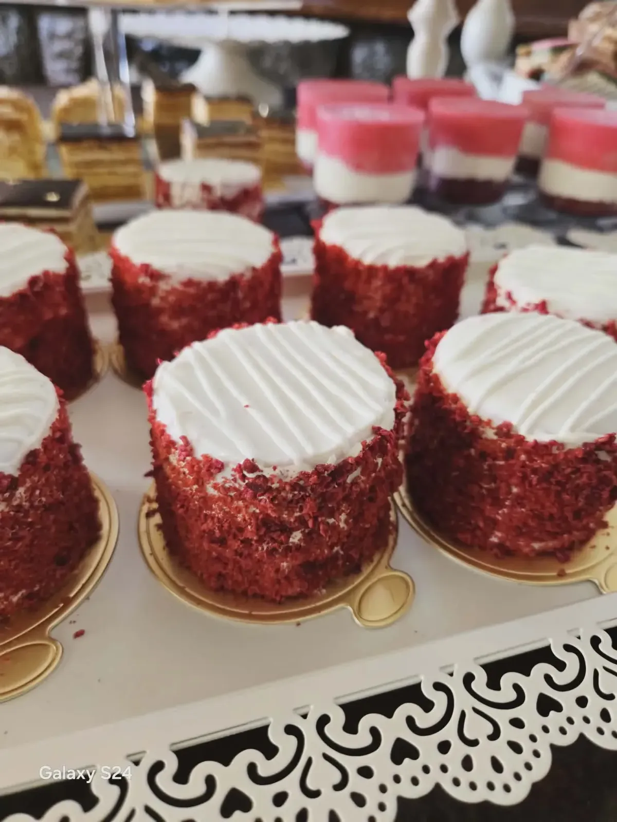 Mini celebration cake with pink buttercream and delicate decorative details