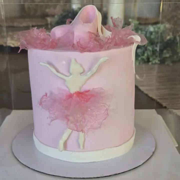 Original carrot cake with chocolate drip and piped buttercream frosting