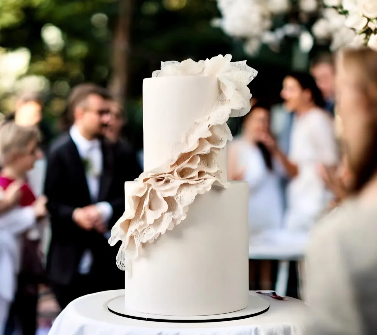 Elegant wedding cake with heart design and smooth white buttercream finish