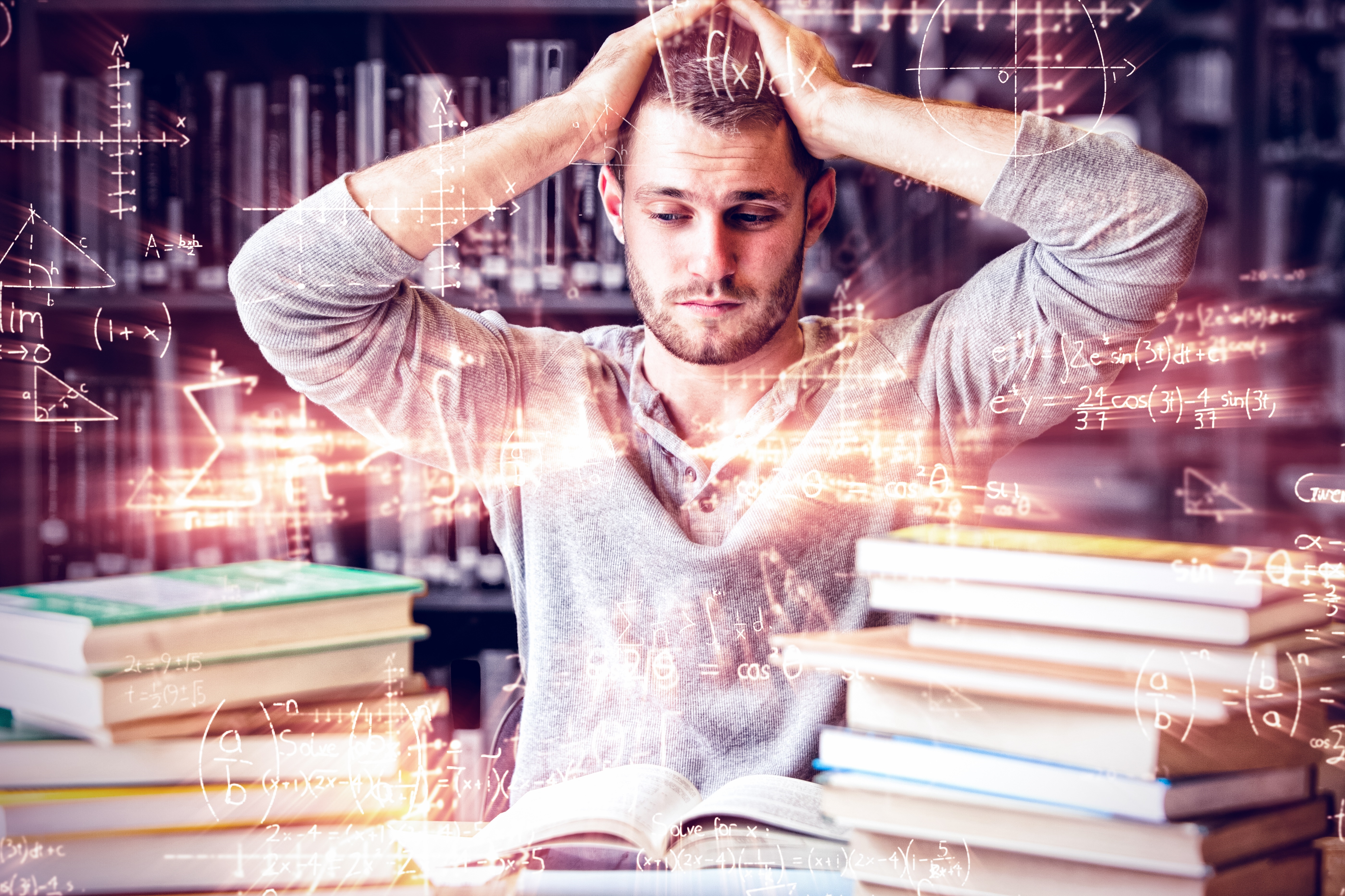 baby sitting on bed while reading on book